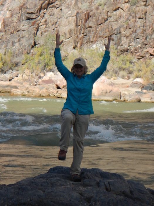 judi doing flamingo pose at the grand canyon