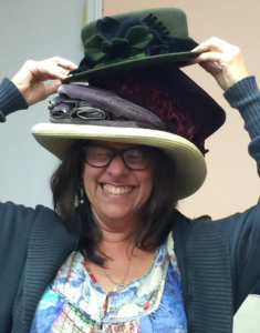 Photo of Sarah wearing multiple hats at the same time